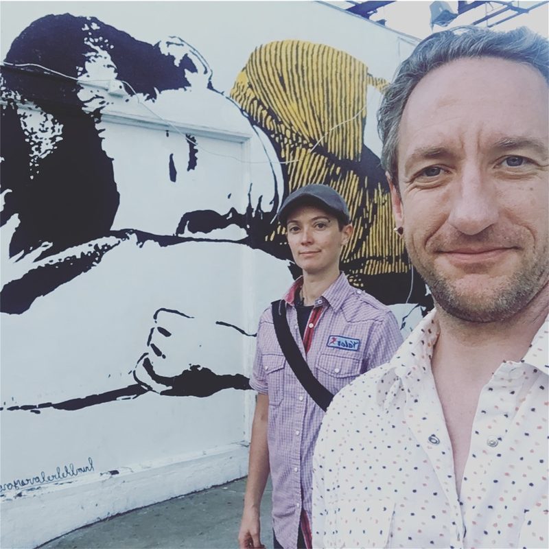 Amy and Gary in front of a mural, 2016
